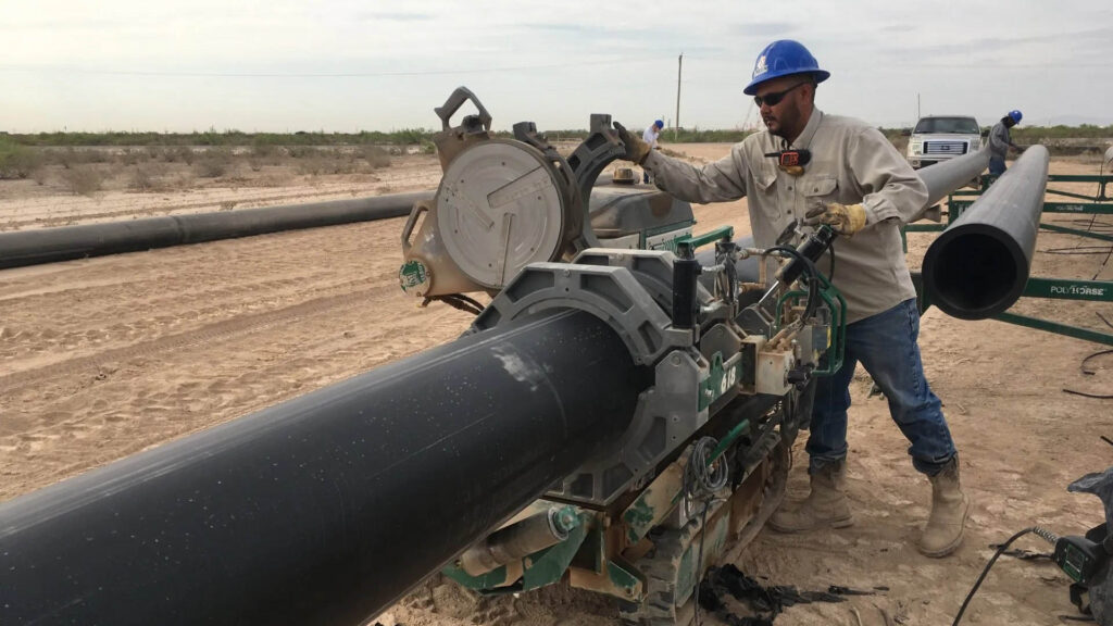 oilfield pipe construction worker at work